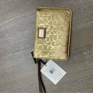 Calvin Klein small wristlet. Gold.